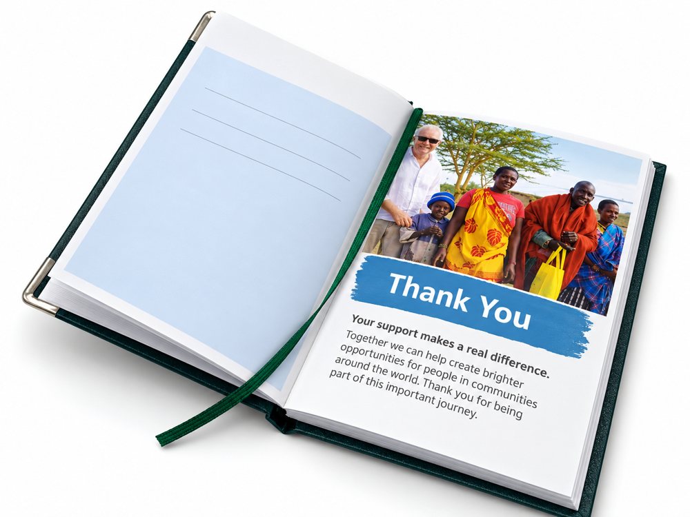 Open notebook with a Thank You page, a donor photo and a green ribbon